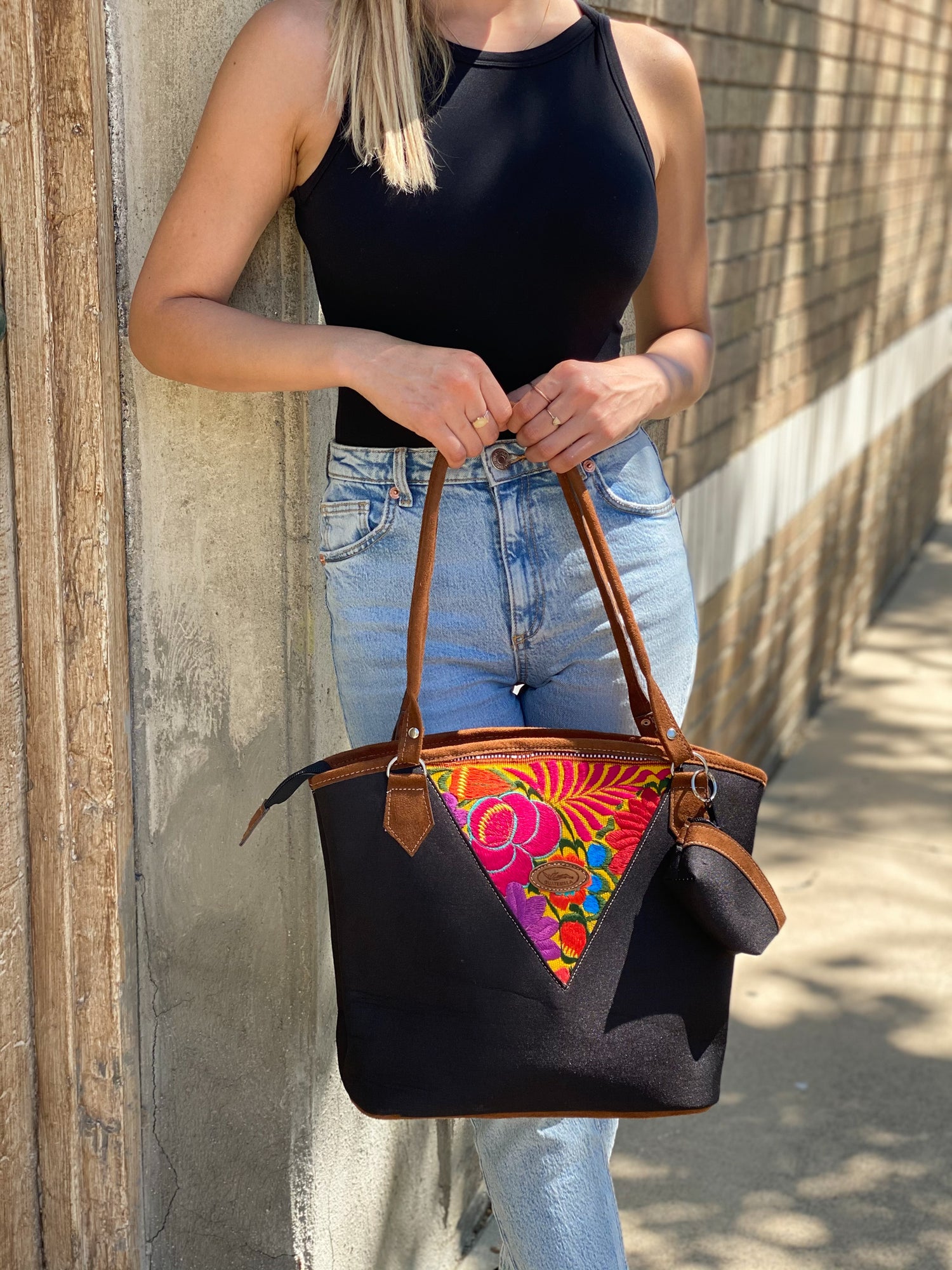 Black embroidery tote bag with floral detail. Handmade in Guatemala with Handwoven intricate fabric. The perfect laptop or beach bag. 