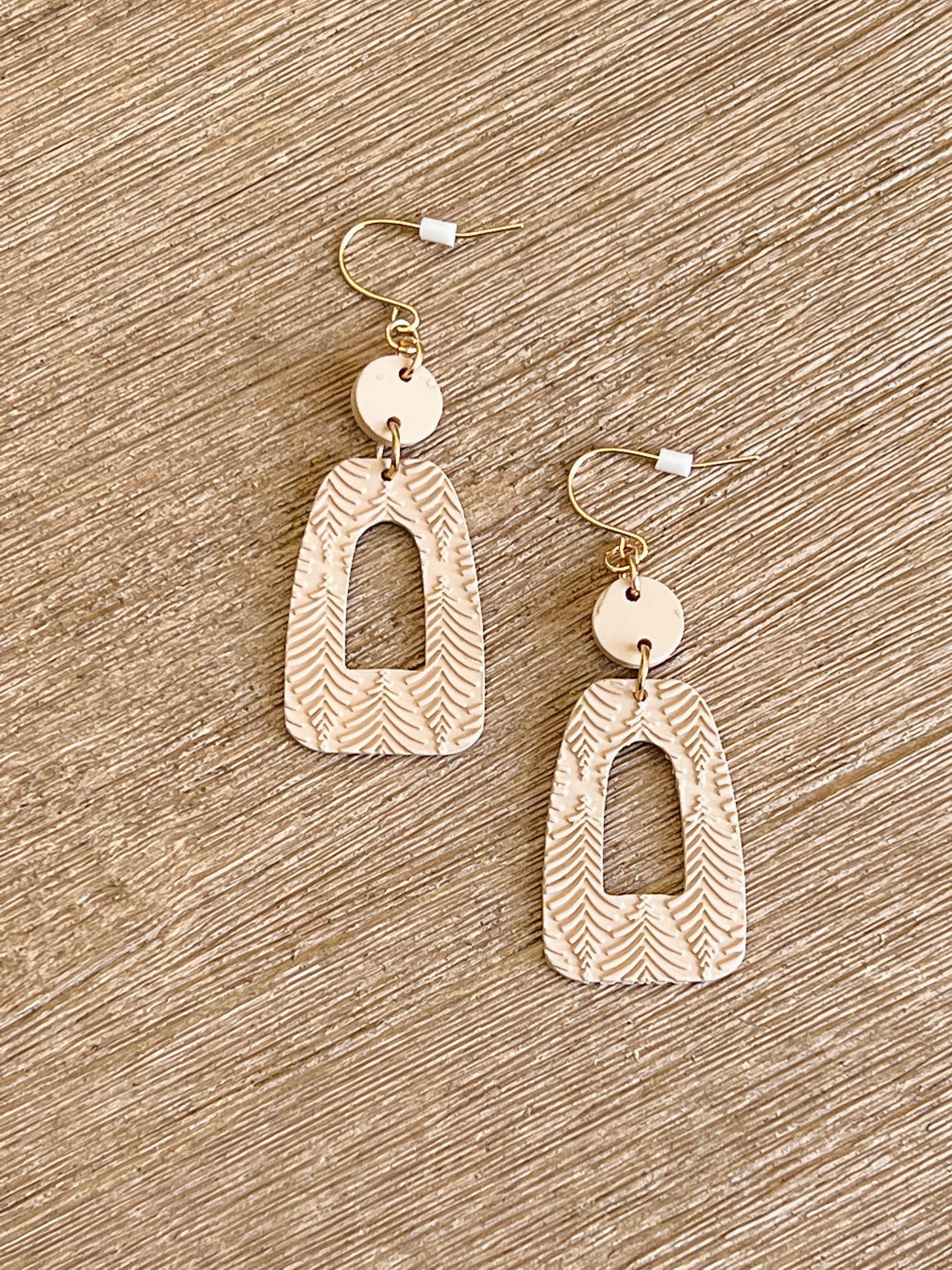 Nothing can pair better than these Cream Geometric Drop Earrings! Lightweight with a unique shape making them the perfect compliment to your look.    Clay Material  2'' Long Plastic Backing Made in China.