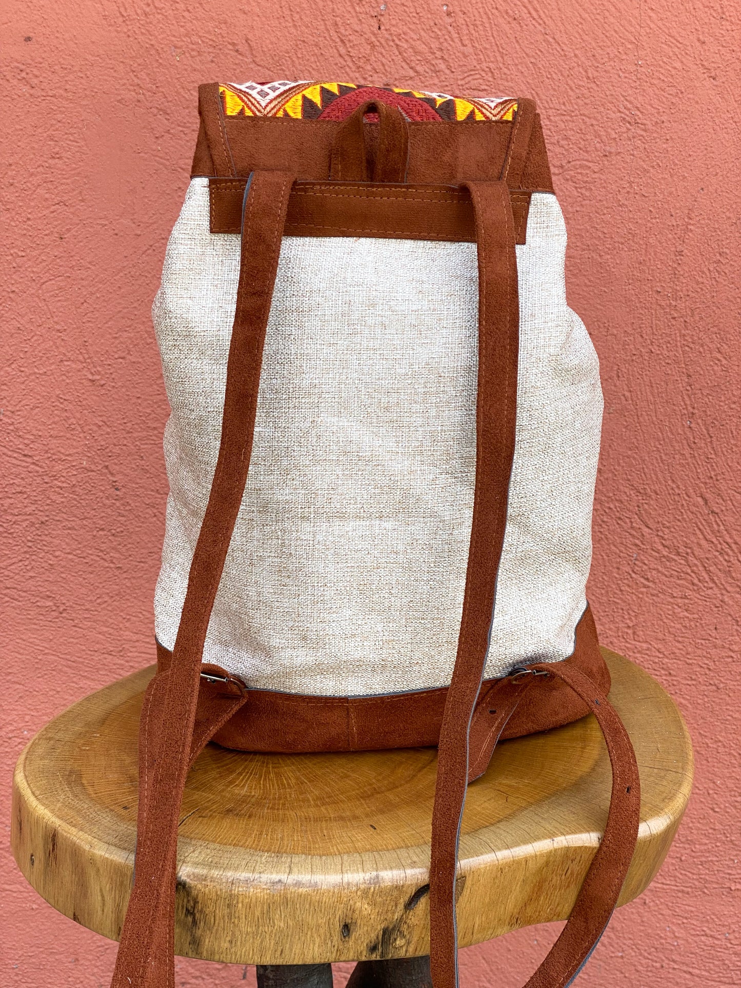 Atardecer Huipil Backpack. Handmade in Guatemala Handwoven Intricate Fabric Front Zipper Pocket Adjustable Straps Belt Buckle Closure.