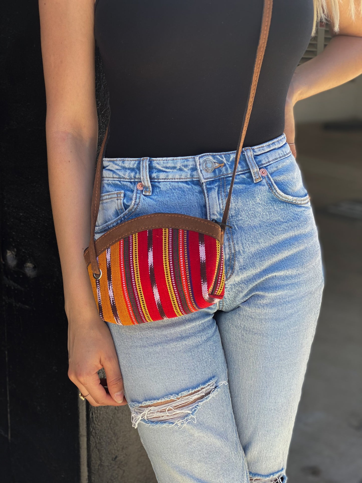 Handmade in Guatemala Small Crossbody Bag. Handwoven intricate fabric. Vibrant colors and faux suede straps and detail. Front zipper closure. Perfect for summer and super lightweight.