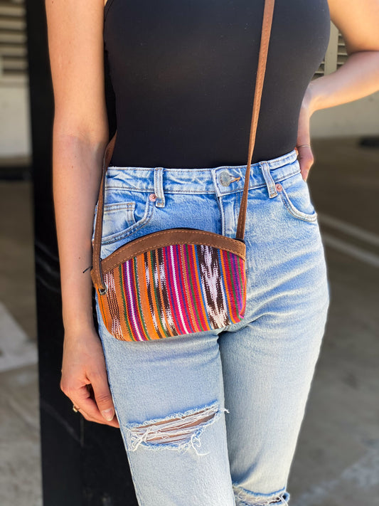 Handmade in Guatemala Small Crossbody Bag. Handwoven intricate fabric. Vibrant colors and faux suede straps and detail. Front zipper closure. Perfect for summer and super lightweight. 