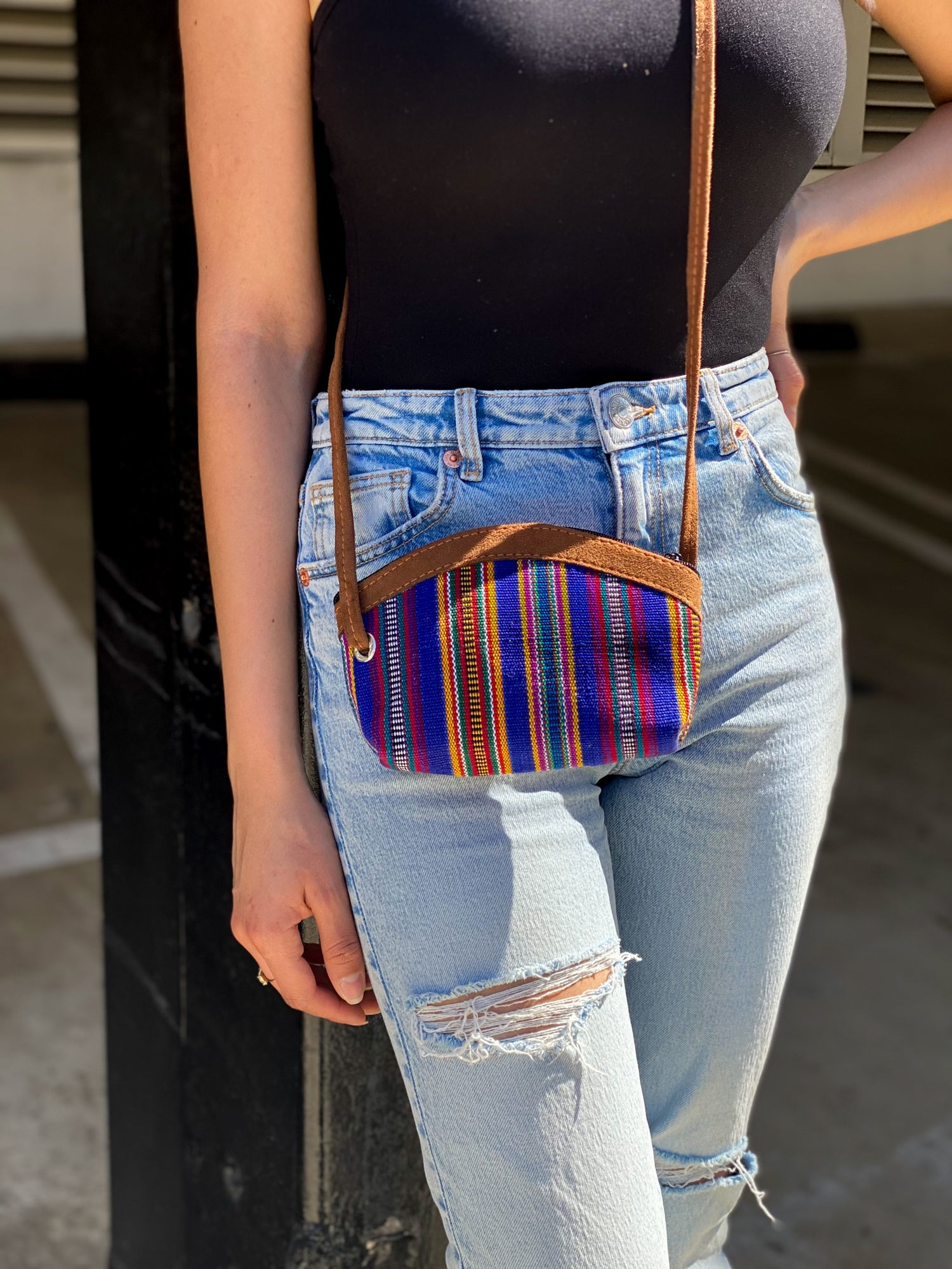 Handmade in Guatemala Small Crossbody Bag. Handwoven intricate fabric. Vibrant colors and faux suede straps and detail. Front zipper closure. Perfect for summer and super lightweight.