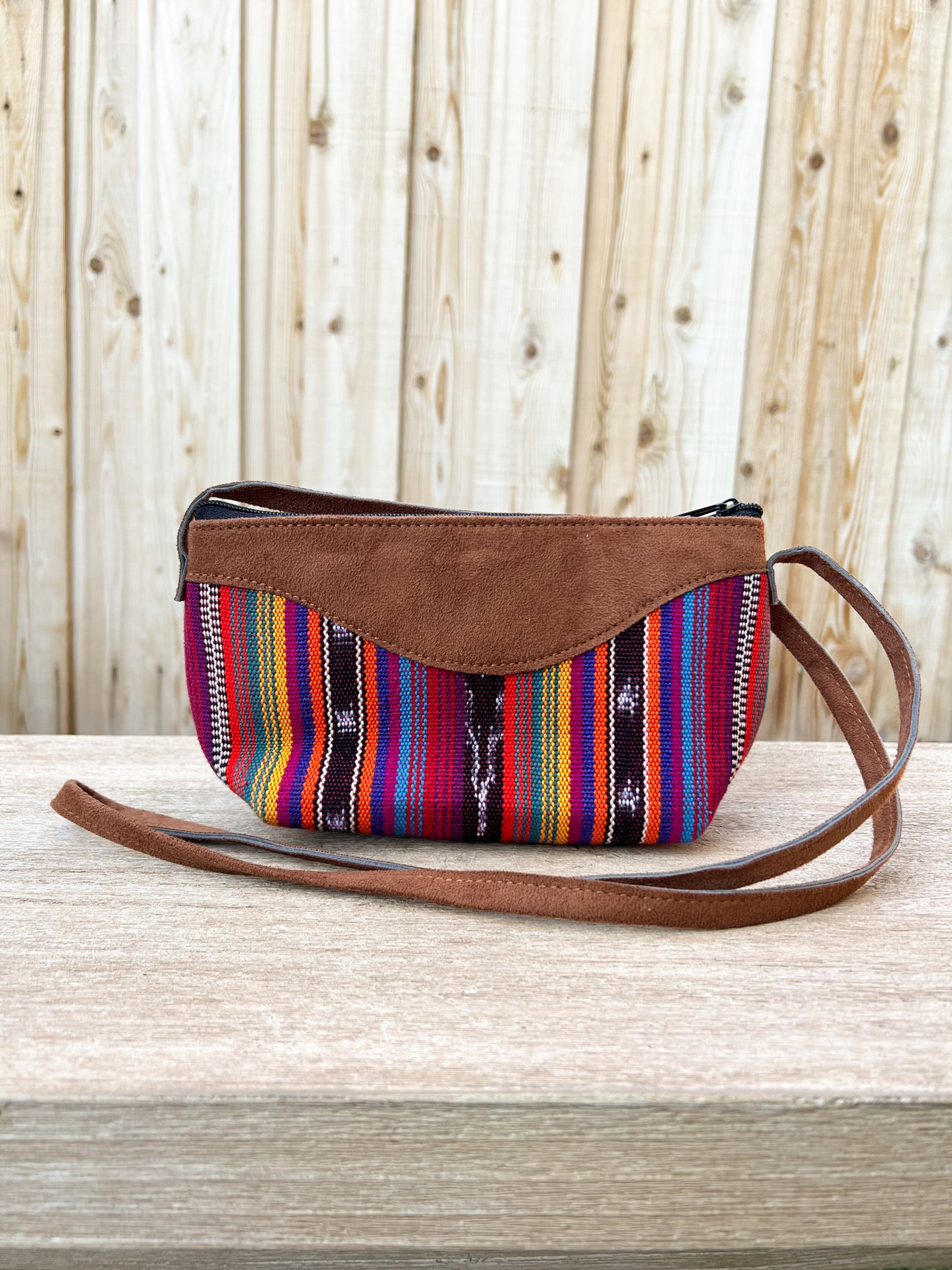 Our "Quetzal Crossbody Bags" are handmade in Guatemala. It's vibrant and colorful textiles make them a perfect and unique standout piece. A perfect size for your essentials only. Handwoven Intricate Fabric. Faux Suede Straps. Zipper Closure. Fully Lined. Handmade in Guatemala