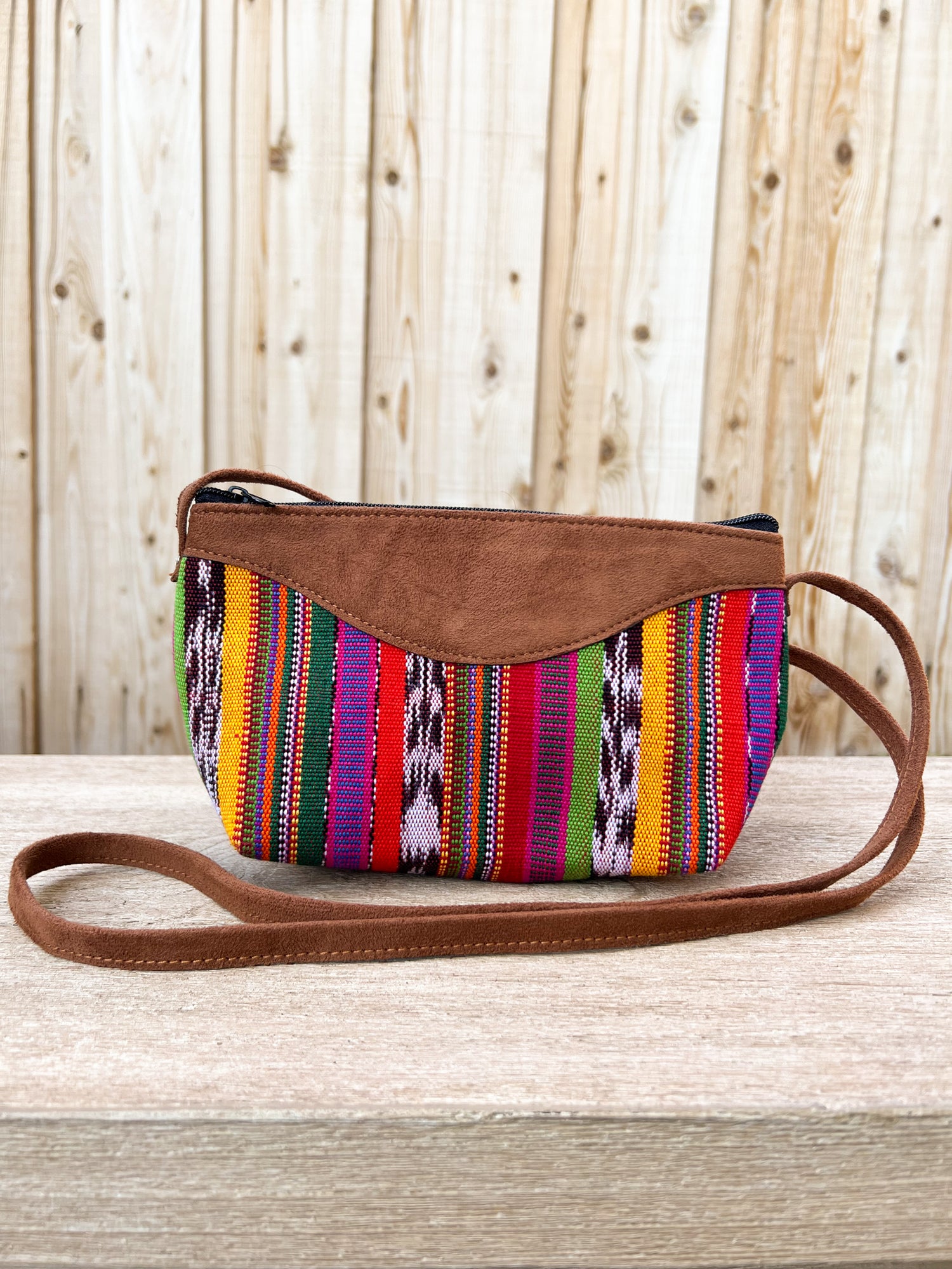 Our "Quetzal Crossbody Bags" are handmade in Guatemala. It's vibrant and colorful textiles make them a perfect and unique standout piece. A perfect size for your essentials only. Handwoven Intricate Fabric. Faux Suede Straps. Zipper Closure. Fully Lined. Handmade in Guatemala.