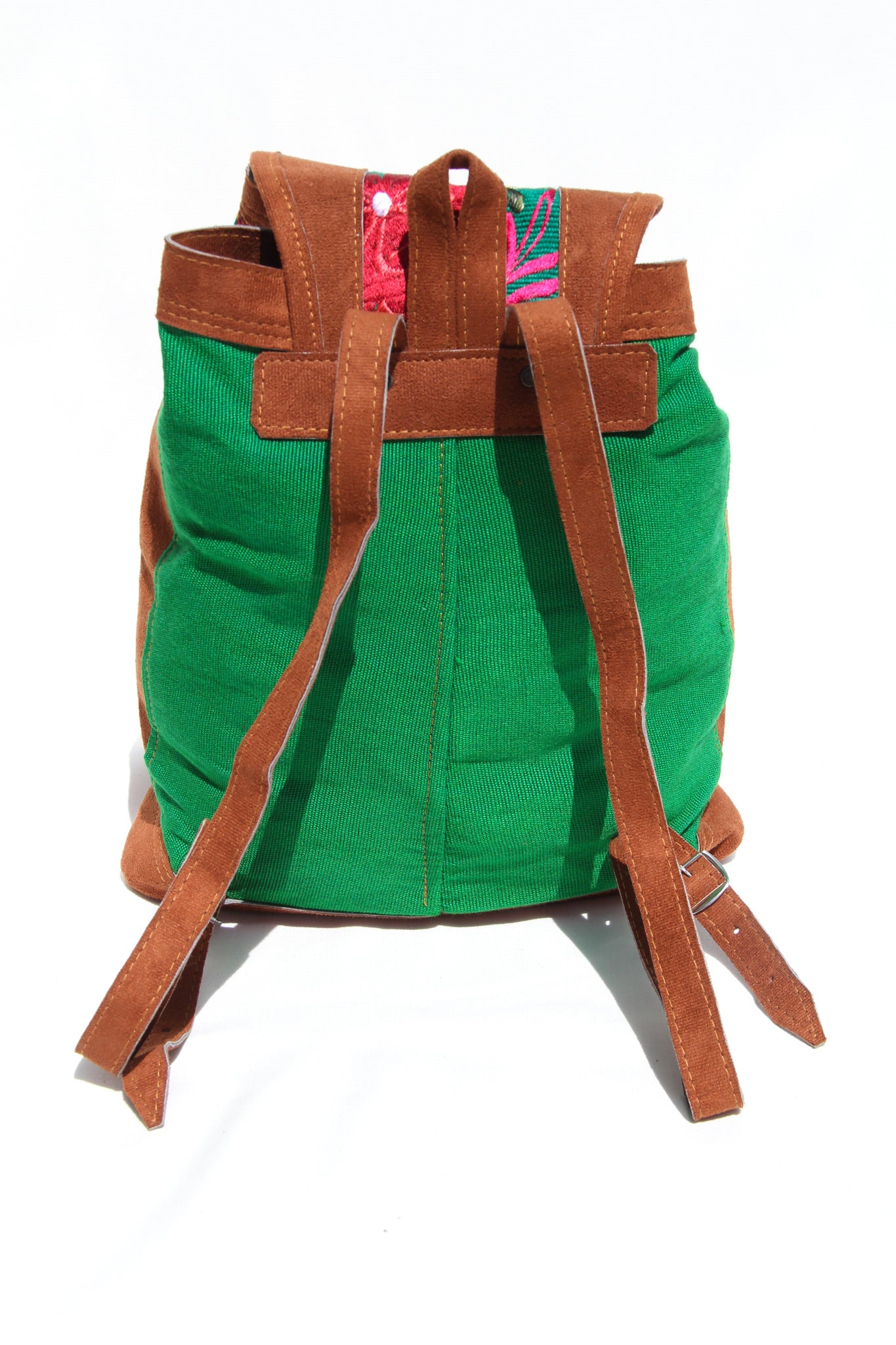 colorful huipil floral embroidery backpack green woven fabric and faux suede contrast with adjustable straps and front buckle closure with front zipper pocket the prefect travel, hiking or beach bag unique bag great for back to school take this bag on your next destination boho bag and hippie style bag a great standout accessories made in Guatemala