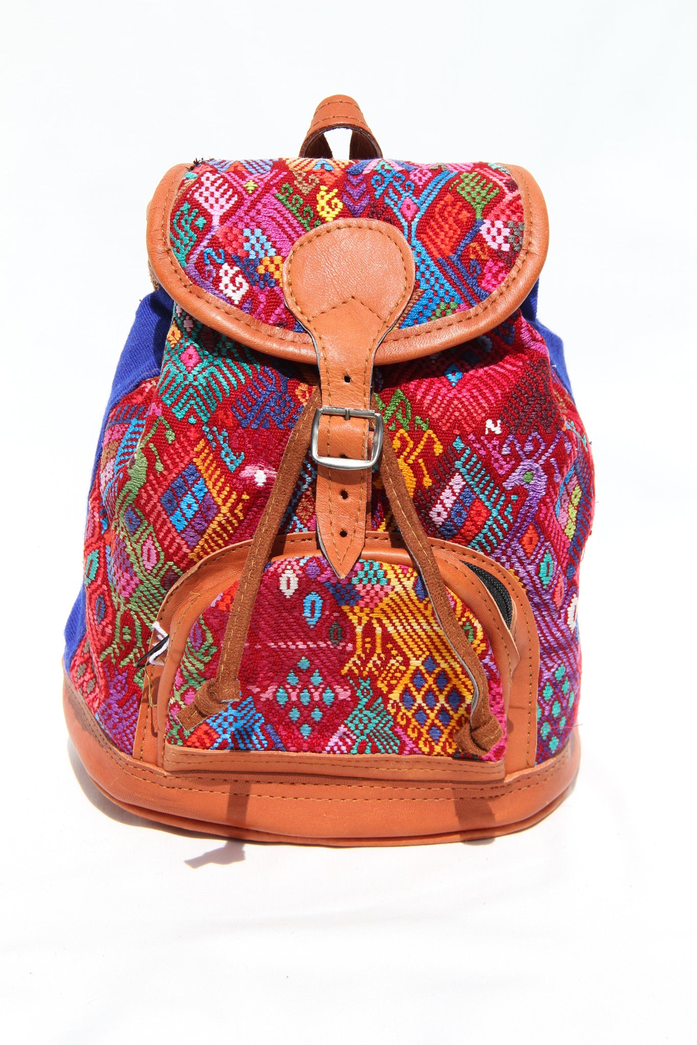 MIni leather huipil backpack hand woven with colorful embroidery and adjustable leather straps with front  belt buckle closure and front zipper pocket perfect for hiking or beach trip