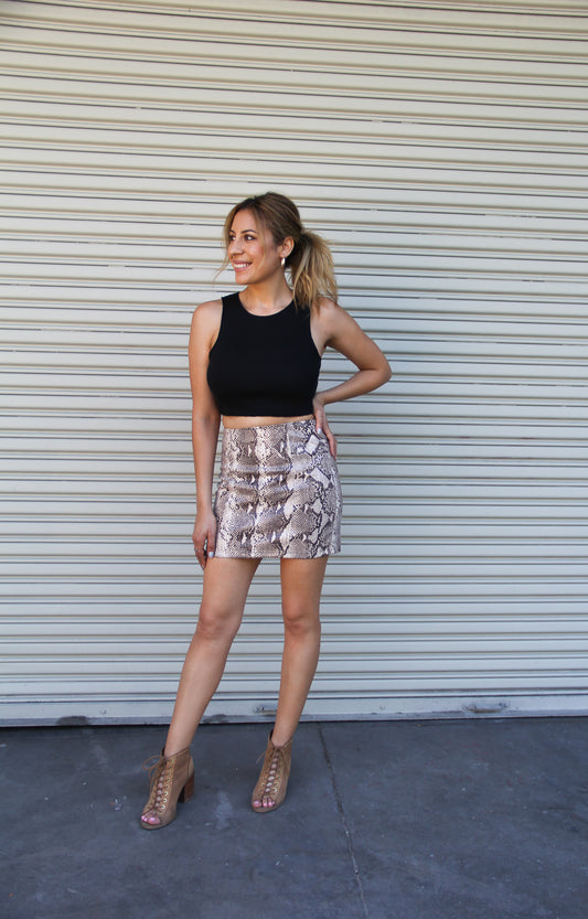 Women's Edgy Snake Print Mini Skirt. Faux Leather and Back Zipper Closure. Perfect for a date night out!