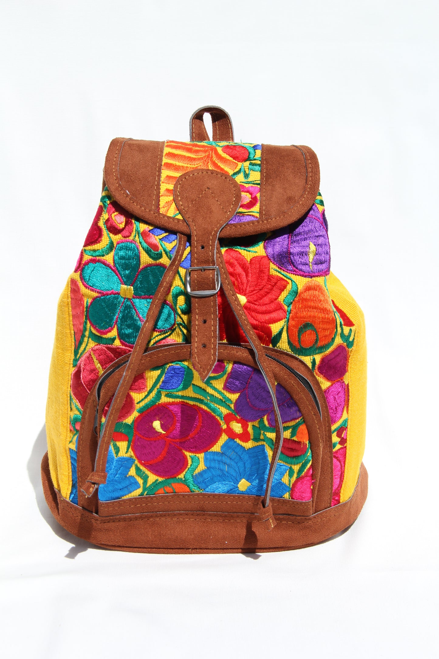 colorful huipil floral embroidery backpack with yellow woven fabric and faux suede contrast with adjustable straps and front buckle closure with front zipper pocket the prefect travel, hiking or beach bag unique bag great for back to school take this bag on your next destination boho bag and hippie style bag a great standout accessories made in Guatemala