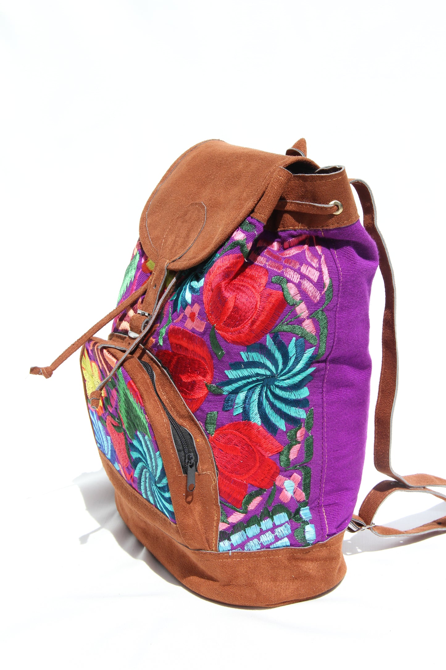 colorful huipil floral embroidery backpack purple woven fabric and faux suede contrast with adjustable straps and front buckle closure with front zipper pocket the prefect travel, hiking or beach bag unique bag great for back to school take this bag on your next destination boho bag and hippie style bag a great standout accessories made in Guatemala
