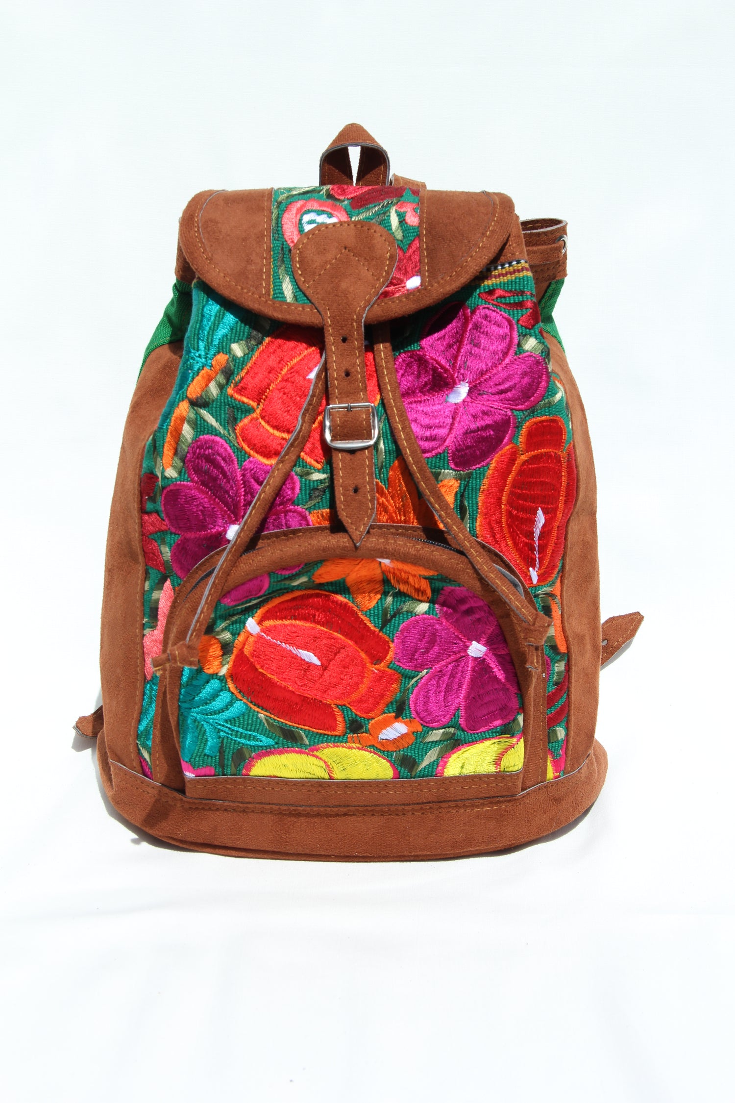 colorful huipil floral embroidery backpack green woven fabric and faux suede contrast with adjustable straps and front buckle closure with front zipper pocket the prefect travel, hiking or beach bag unique bag great for back to school take this bag on your next destination boho bag and hippie style bag a great standout accessories made in Guatemala