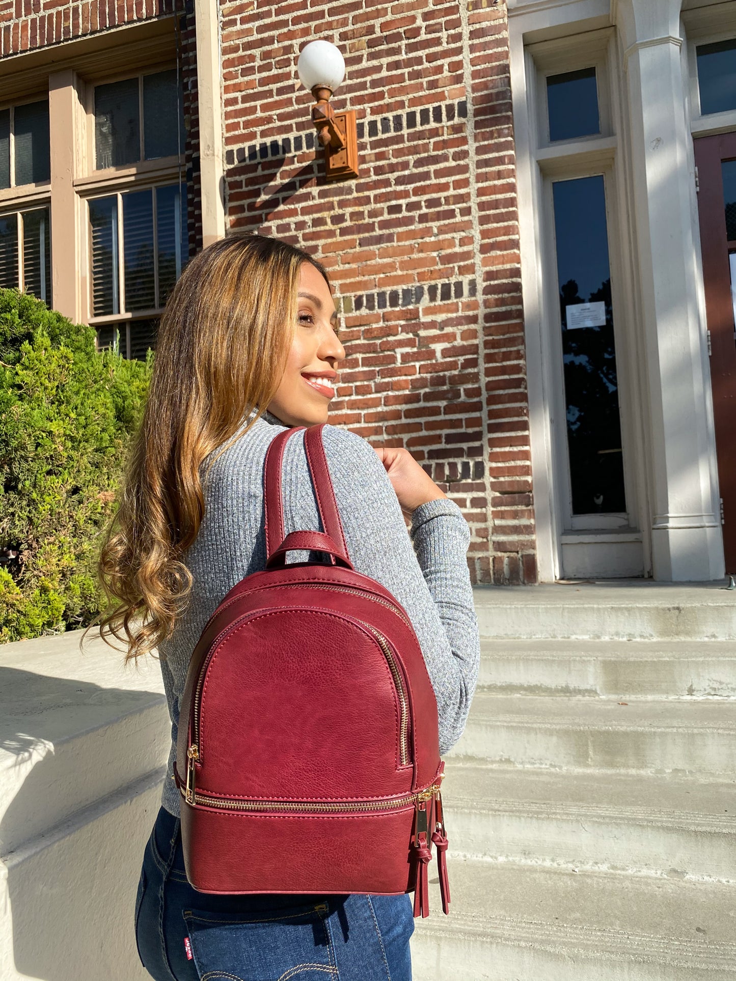 Runyon Backpack. Adjustable Straps Gold Metal Trimming Top Handle Burgundy  PU Leather & Polyester Lining 9'' Width x 10'' Height.