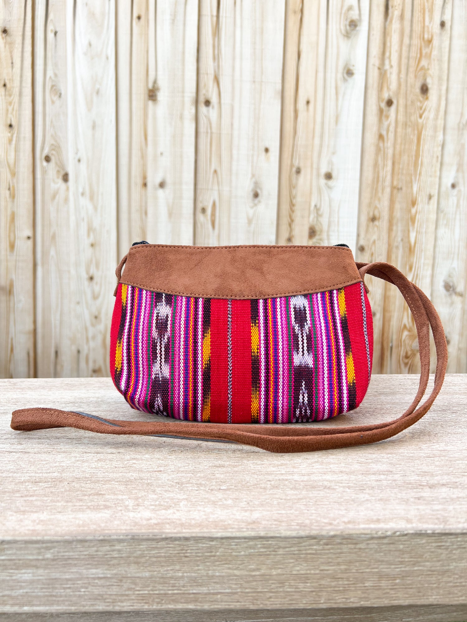 Our "Quetzal Crossbody Bags" are handmade in Guatemala. It's vibrant and colorful textiles make them a perfect and unique standout piece. A perfect size for your essentials only. Handwoven Intricate Fabric. Faux Suede Straps. Zipper Closure. Fully Lined. Handmade in Guatemala.