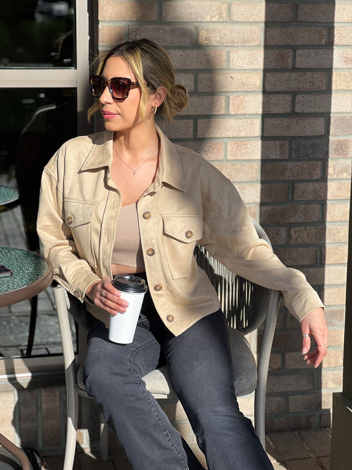 The Running Late Cropped Jacket is lightweight and versatile. Beige color wit brown buttons. Soft faux suede, boxy fit, full button placket, with a collared neckline and buttoning flap pockets.   Beige 95% Polyester and 5% Spandex Model wearing small .