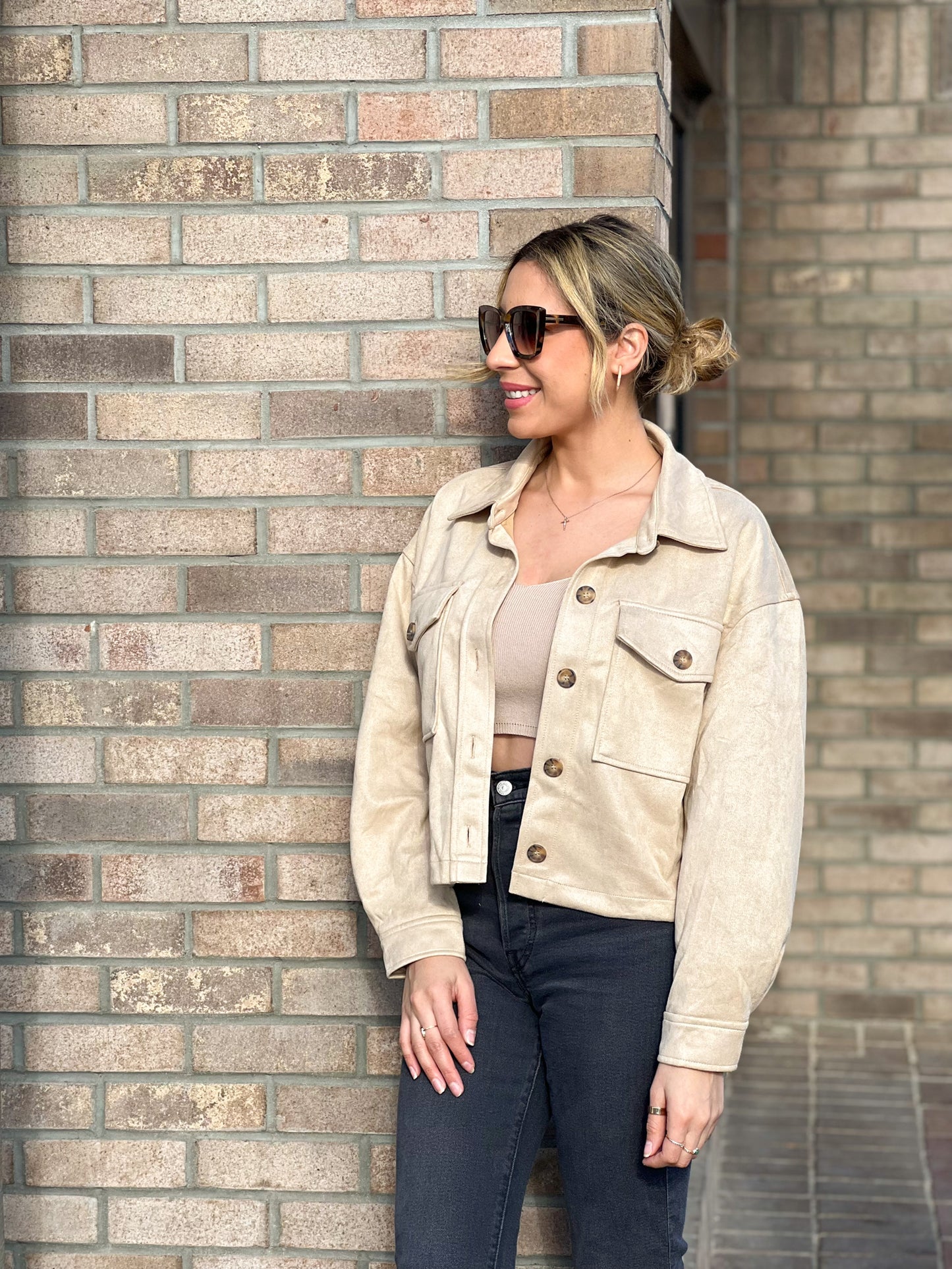 The Running Late Cropped Jacket is perfect for those hectic days when you need to be the out the door ASAP, but still look fabulous!!! Soft faux suede, boxy fit, full button placket, with a collared neckline and buttoning flap pockets.   Beige 95% Polyester and 5% Spandex Model wearing small .