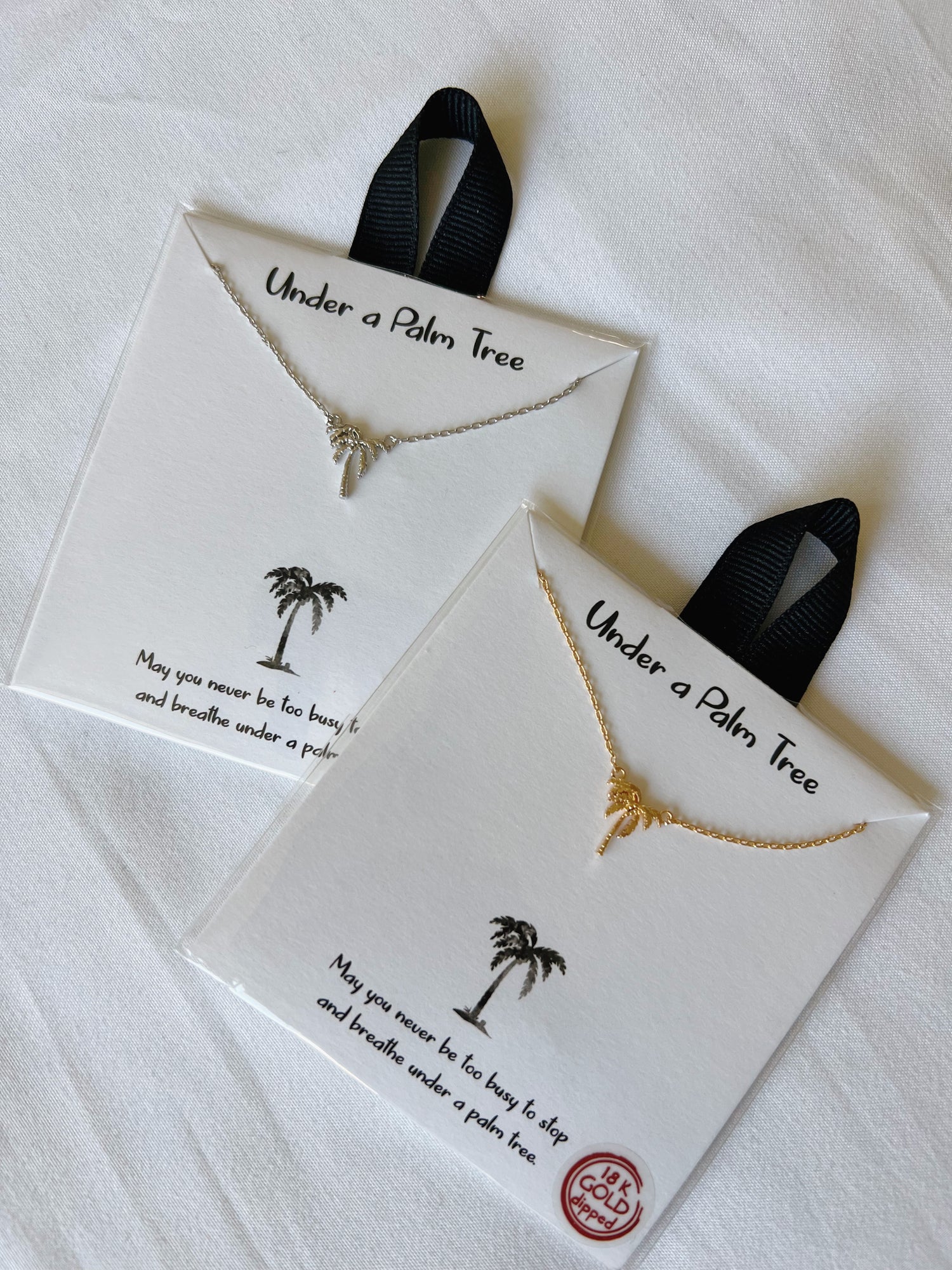 Our new under the palm tree neckalces are cute LA vibes. We carry silver and gold. Make sure to check out our store for more jewelry options. Under A Palm Tree Necklace is the perfect accessory to remind us that island life is what we all dream of!   18K Gold Dipped Palm Tree Charm Silver  Gold